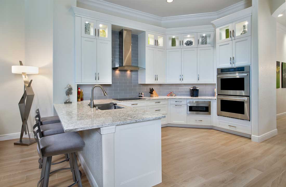 Bonita Springs FL peninsula kitchen remodel white cabinets