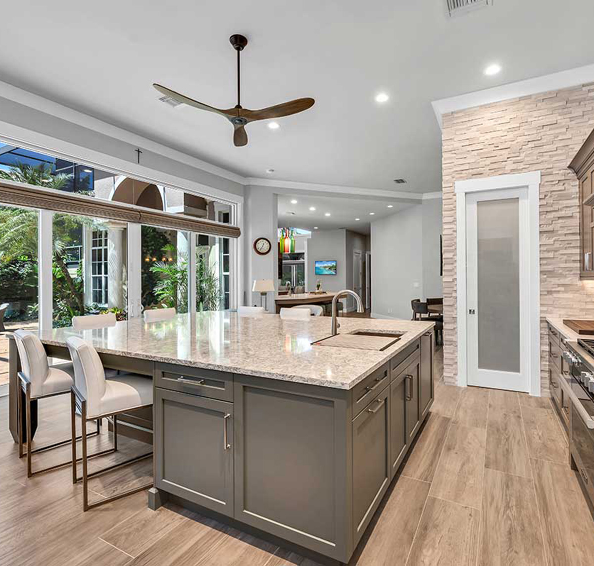 Contemporary interior remodel bonita springs kitchen pantry door closed.