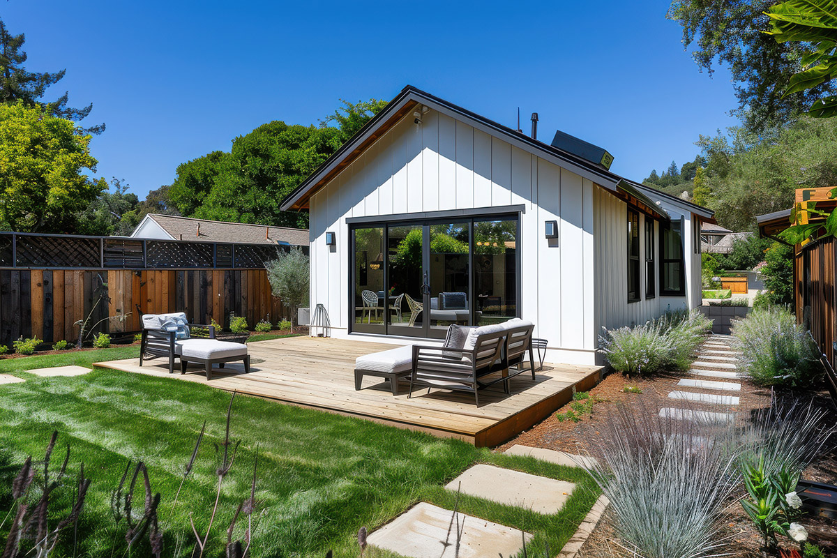 Professional photo of a single-level ADU with modern farmhouse style, frontal elevation view, showcasing the backyard in Marin County, California.